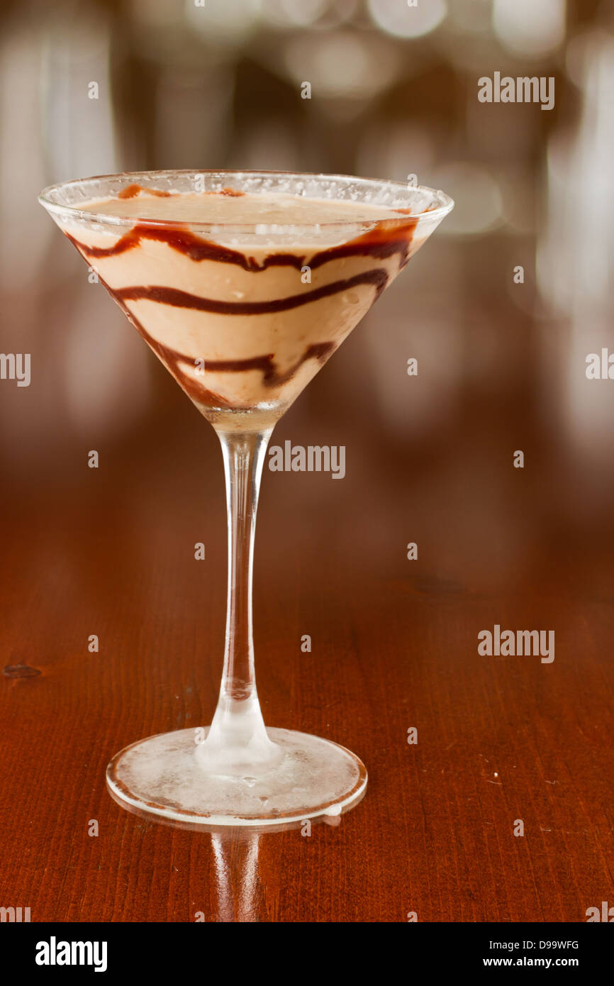 chocolate martini served on busy out of focus bar top Stock Photo