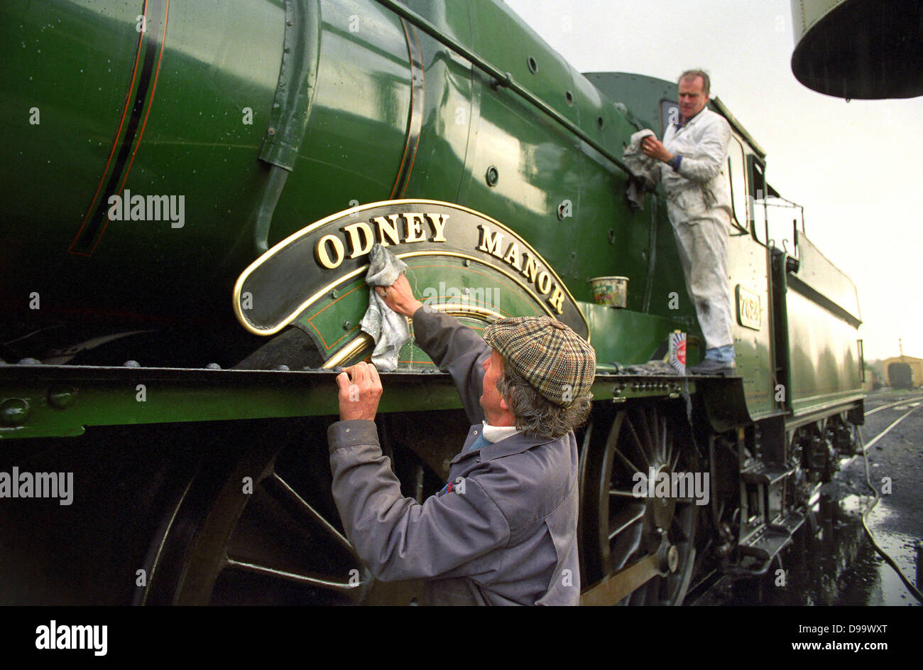 Steam engine being cleaned at West Somerset Railway in Minehead. Stock Photo