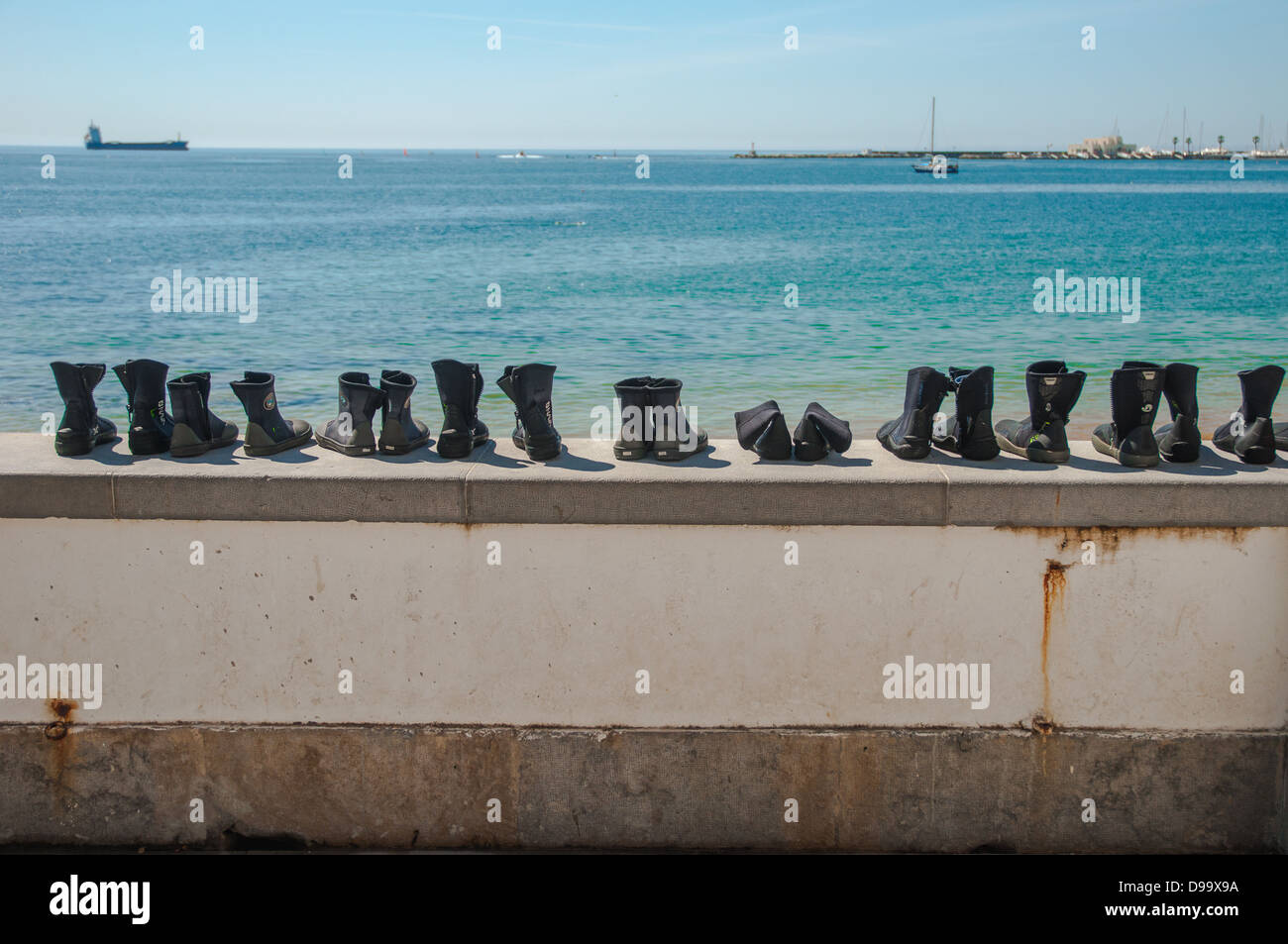 Row of neoprene boots for diving Stock Photo