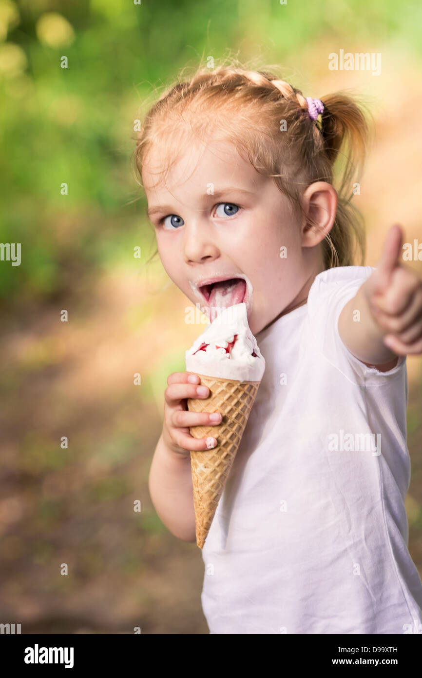Happy cute child eating ice cream outdoor Stock Photo Alamy