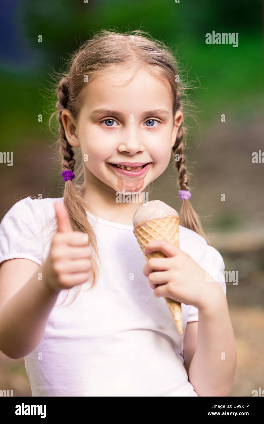 Happy cute child eating ice cream outdoor Stock Photo Alamy