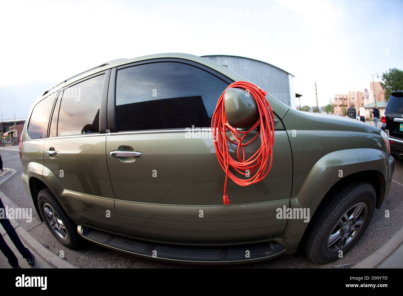 electrical extension cord wrapped around car mirror Stock Photo Alamy