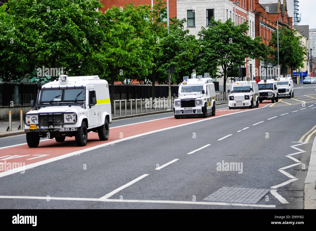 Belfast, Northern Ireland, 15th june 2013.  Hundreds of new armoured Landrovers have been deployed on the streets of Belfast. Some, like the first and fourth in this convoy, are British Army 'Snatch' landrovers, which have been painted in PSNI colours. Credit:  Stephen Barnes/Alamy Live News Stock Photo