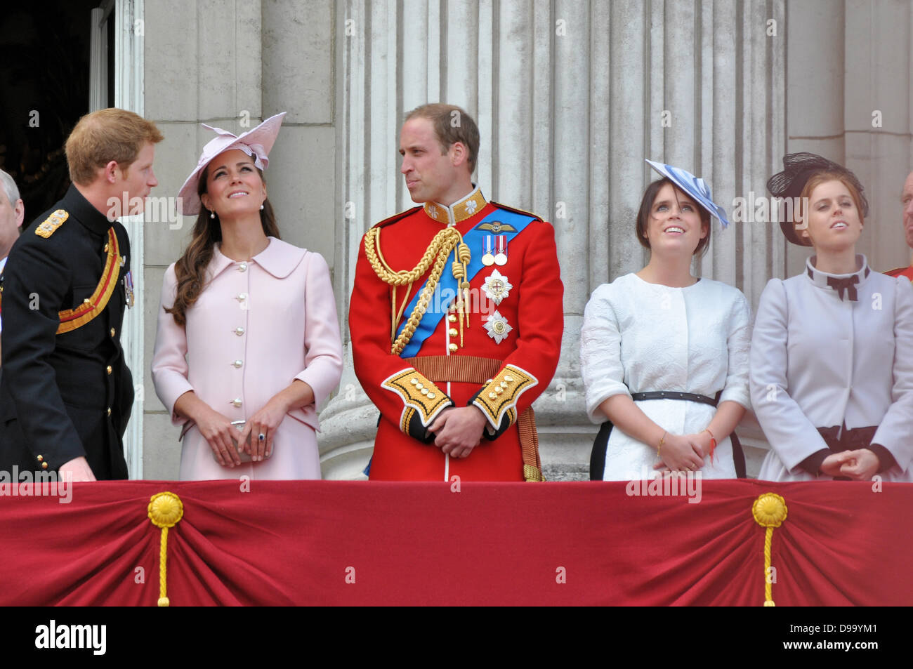 Prince Harry, Kate Middleton, Prince William watching the Queen's Birthday Flypast from the balcony of Buckingham Palace after Trooping the Colour 2013. Eugenie & Beatrice. Princes Harry and William in military uniform Stock Photo