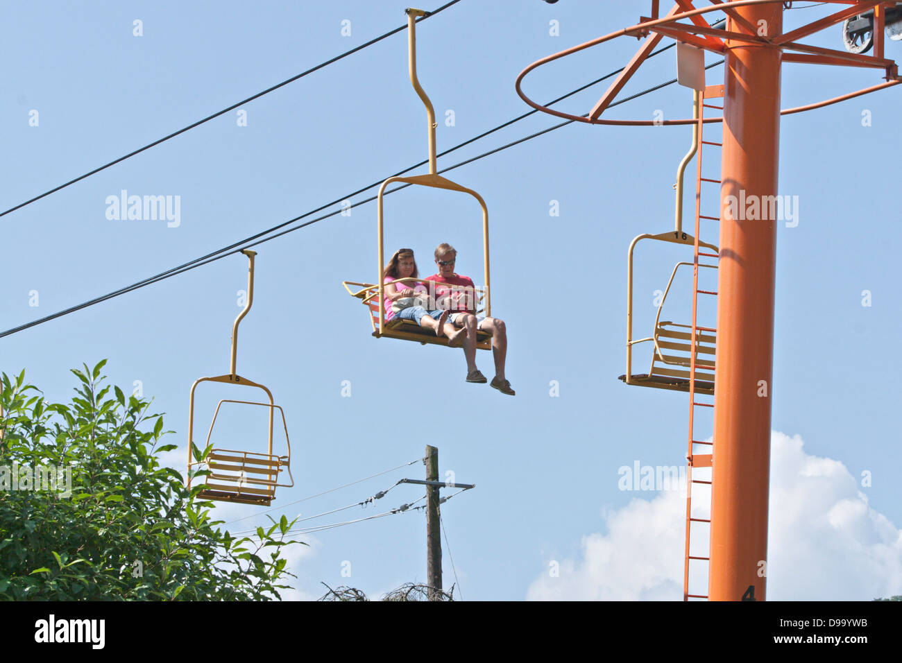 Couple riding incline chair lift in Gatlinburg, Tennessee Stock Photo