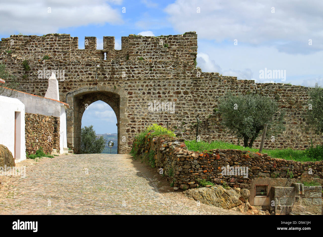Fortification walls and entrance in a street of Evoramonte, , Alantejo, Portugal Stock Photo