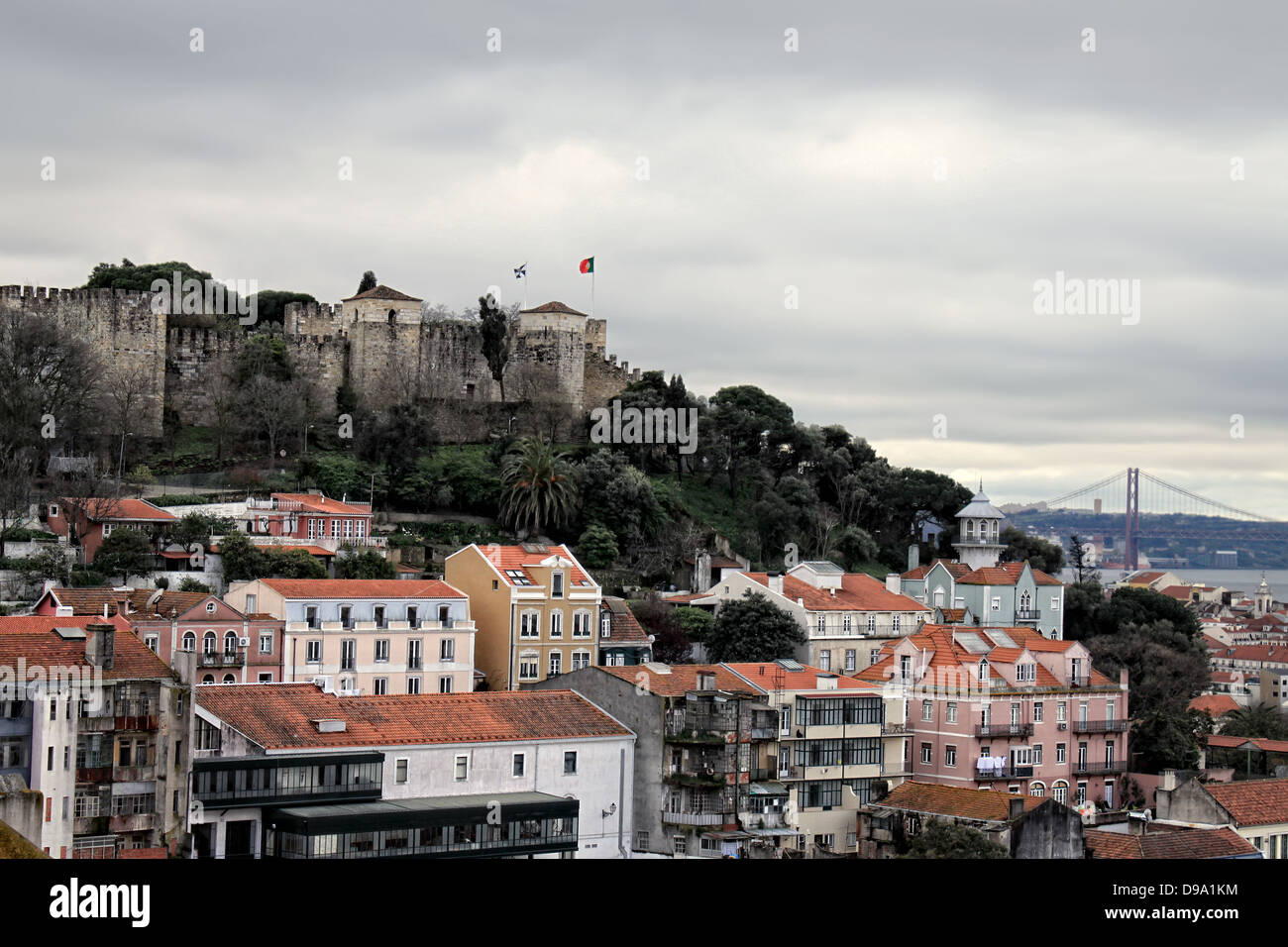 Sao Jorge Castle and view of Lisbon rooftops with bridge in the background Stock Photo