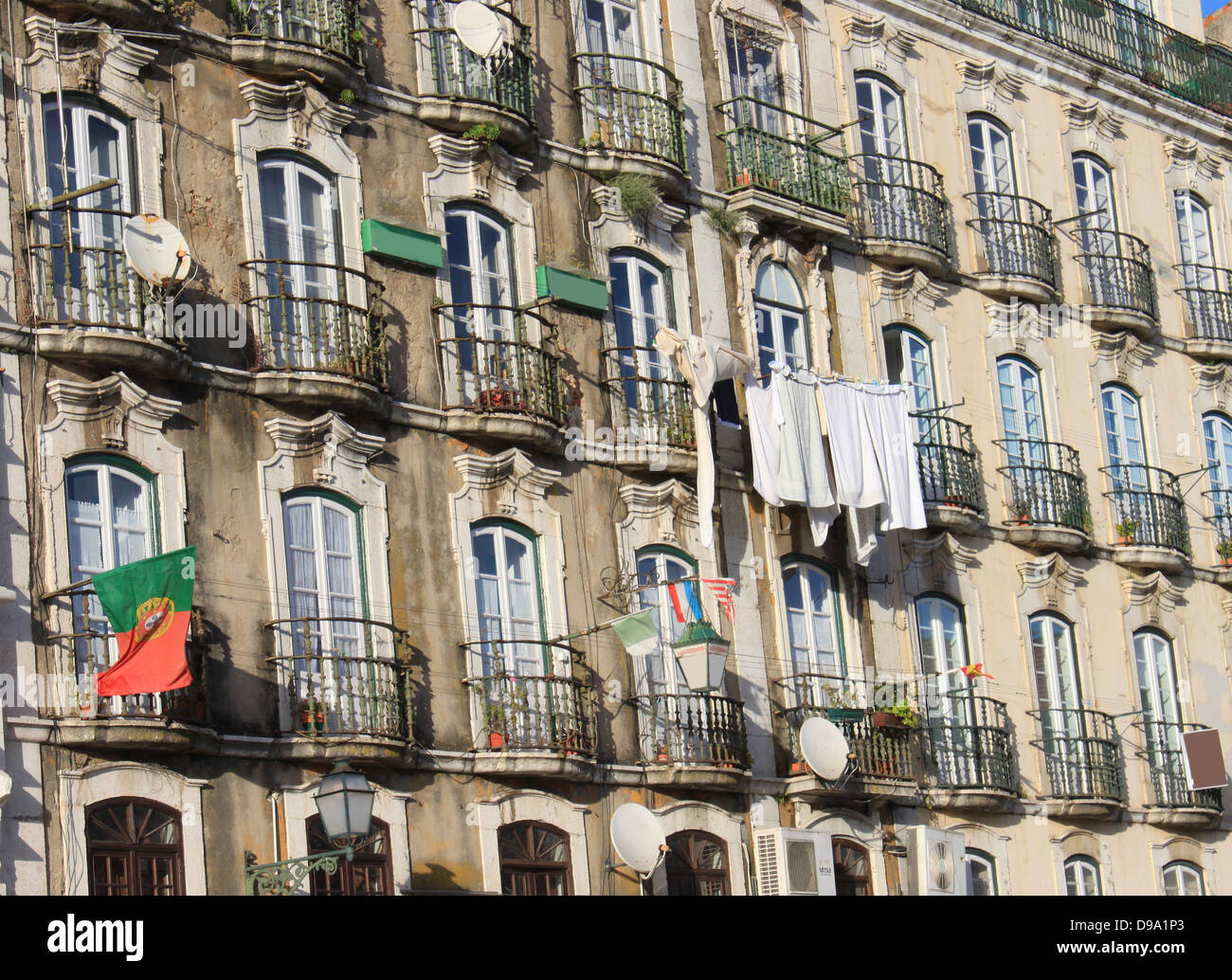 Windows in buildings of Alfama, Lisbon, showing laundry and balconies, Portugal Stock Photo