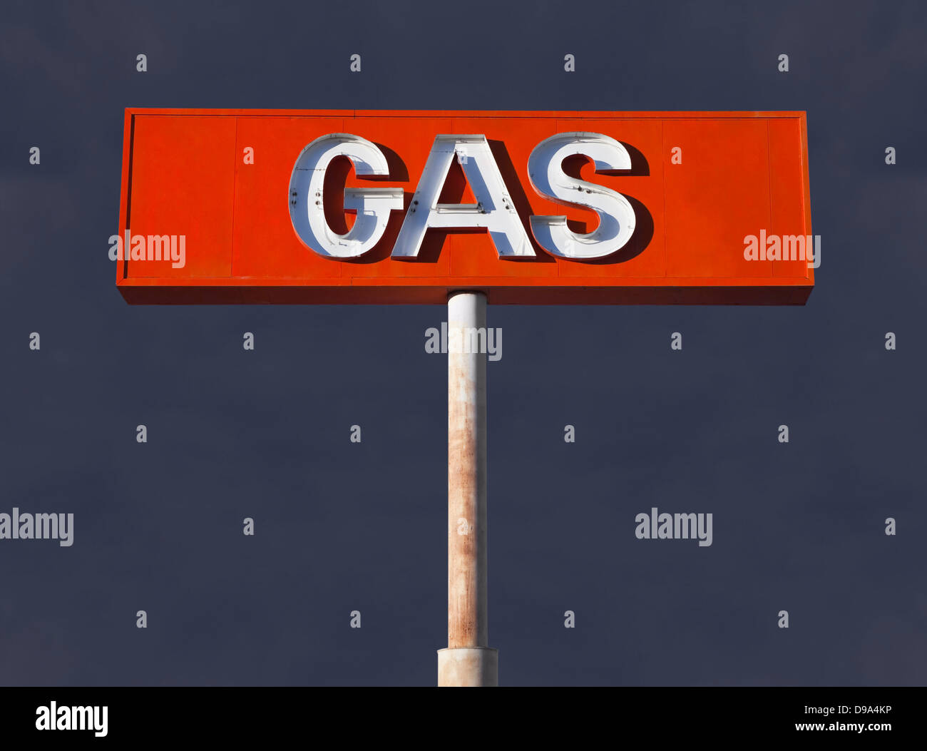Vintage neon gas sign with storm sky. Stock Photo