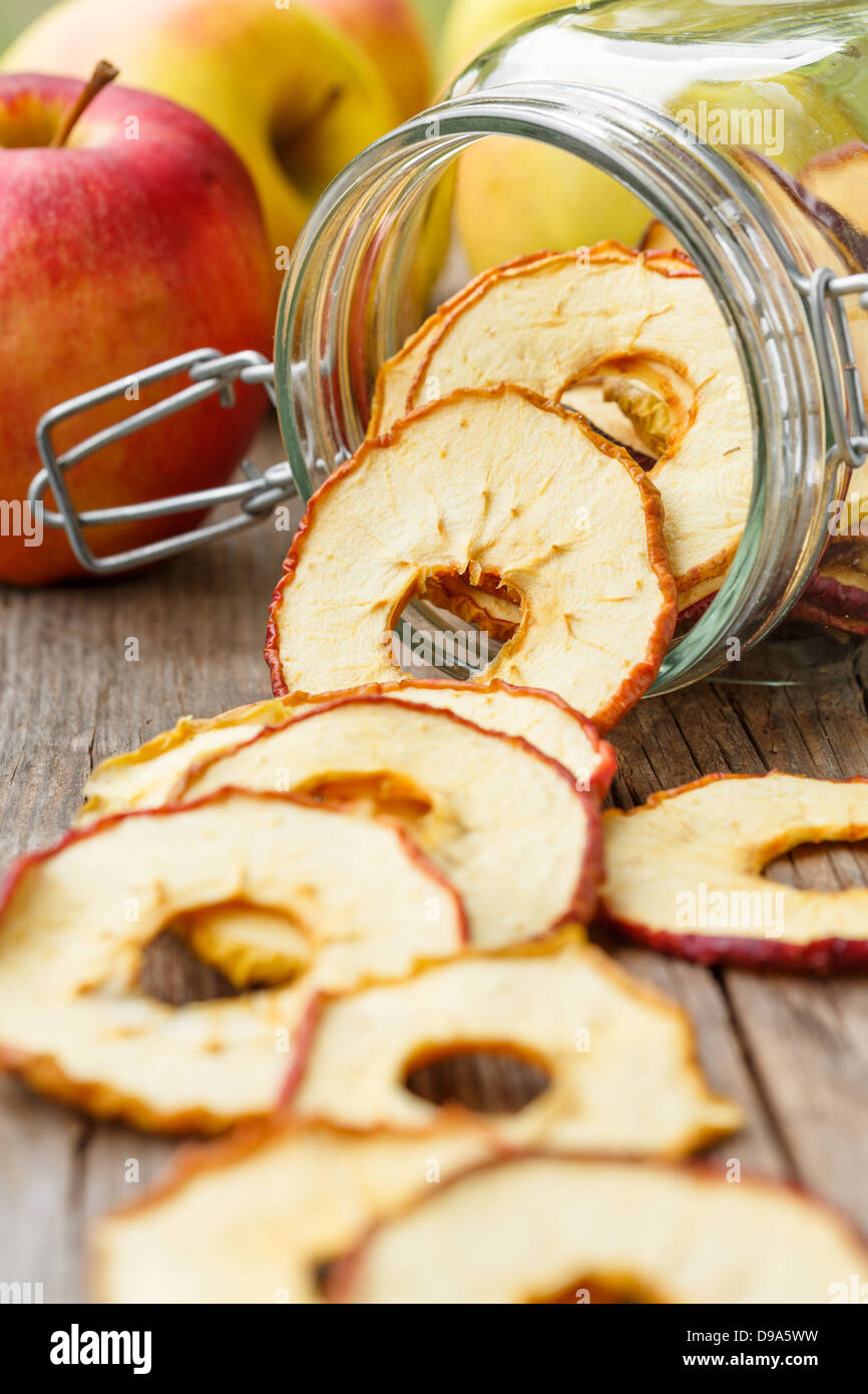 Dried apples rings spilling from a jar Stock Photo Alamy