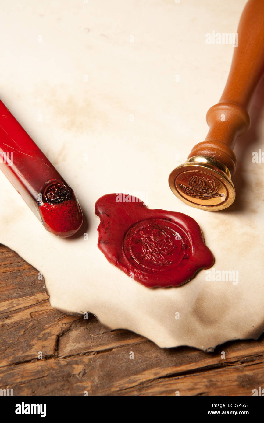 Closeup of an ancient parchment or diploma scroll with wax seal Stock