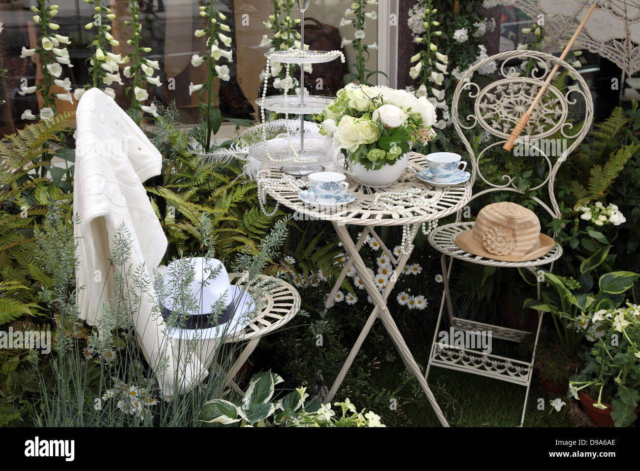 floral pavement display of Brunello Cucinelli, clothes shop in Sloand Street, London during the RHS Chelsea Flower Show 2013 Stock Photo