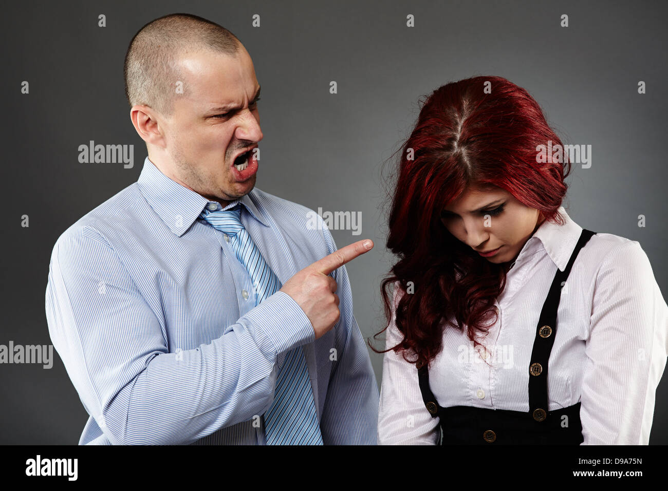Boss angry on a new employee, shouting, threatening Stock Photo