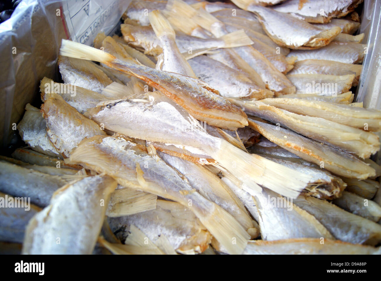 A pile of dried salted fish, sales in the seafood market. Stock Photo