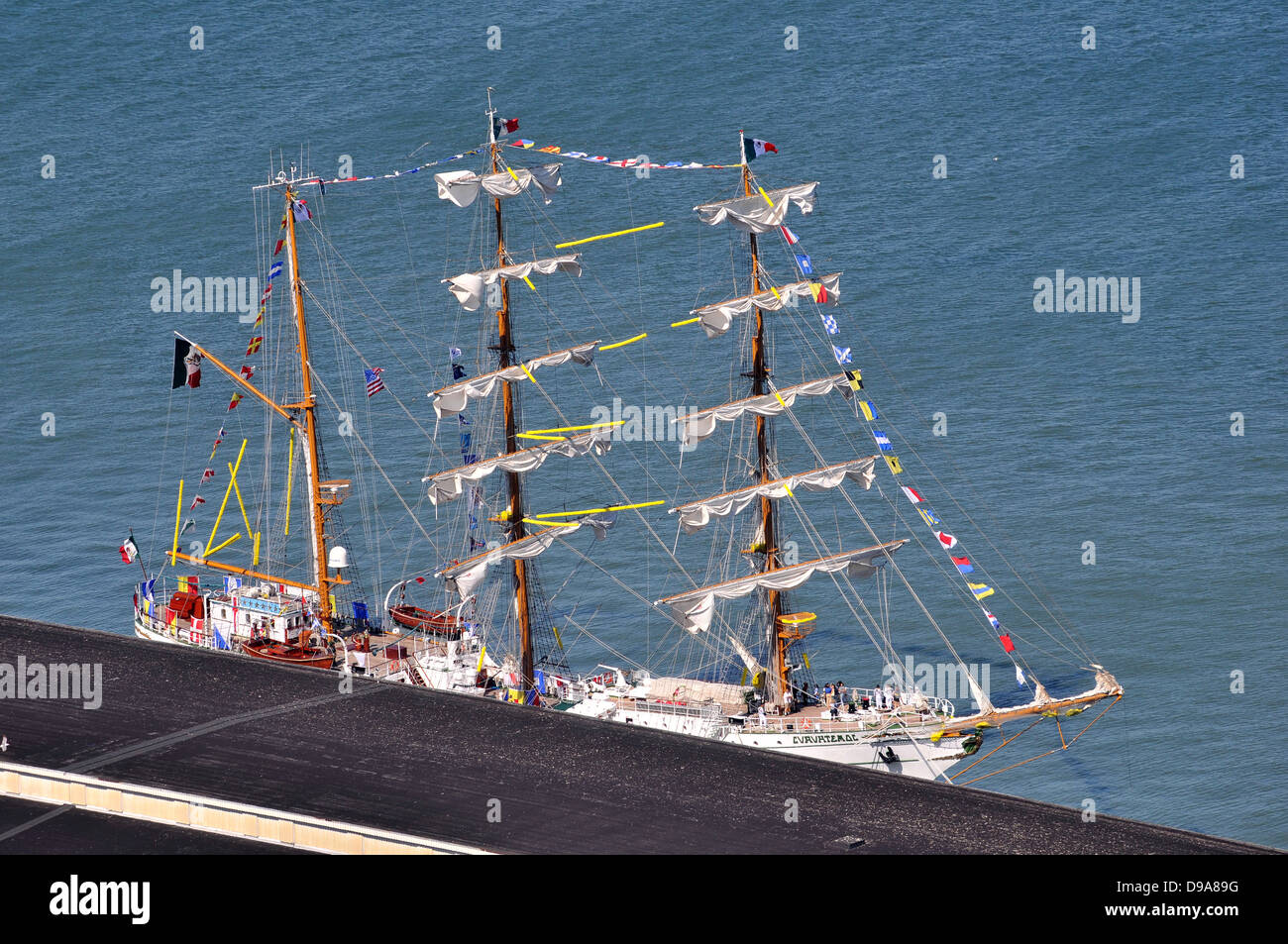 Mexican square rigged sailing ship alongside a pier on the San Francisco Embarcadero - dressed overall with flags Stock Photo