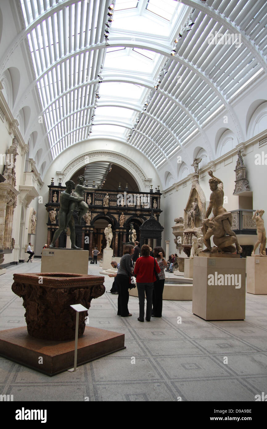 Crowds look at exhibits in the Victoria and Albert Museum, London. The Victoria and Albert Museum (often abbreviated as the V&A) Stock Photo