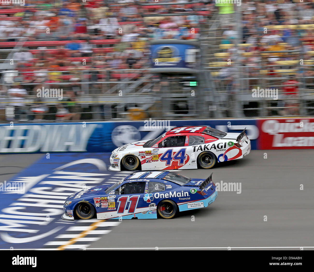 Brooklyn Michigan, MI, United States of America. 15th June, 2013. Nationwide Series driver Elliott Sadler (11) and Nationwide Series driver Cole Whitt (44) race during the Nascar Nationwide Series 22nd Annual Alliance Truck Parts 250 at Michigan International Speedway on June 15, 2013 in Brooklyn, Michigan. Tom Turrill/CSM Credit: csm/Alamy Live News Stock Photo