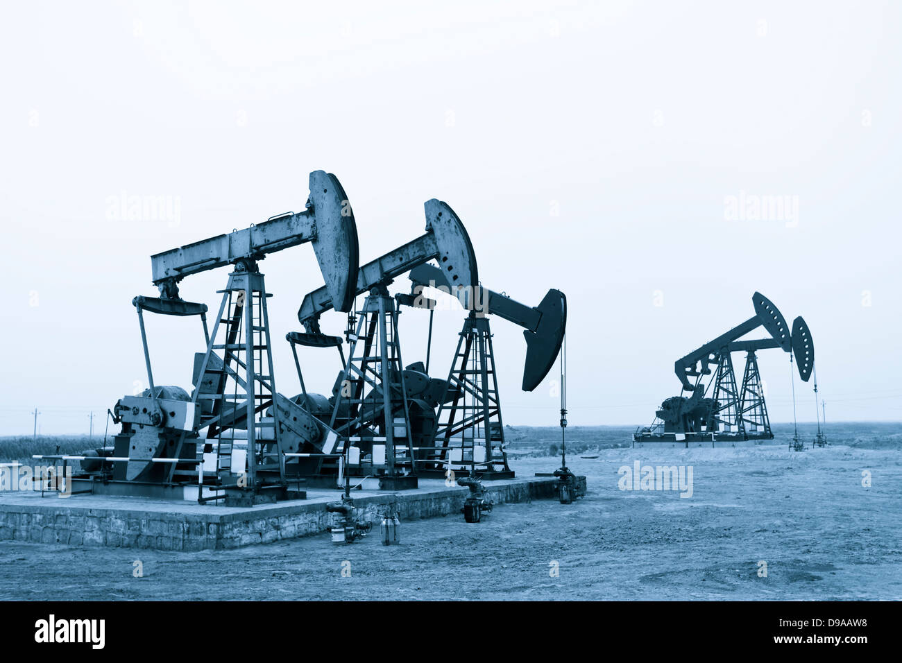 Working oil pumps at prairie Stock Photo Alamy