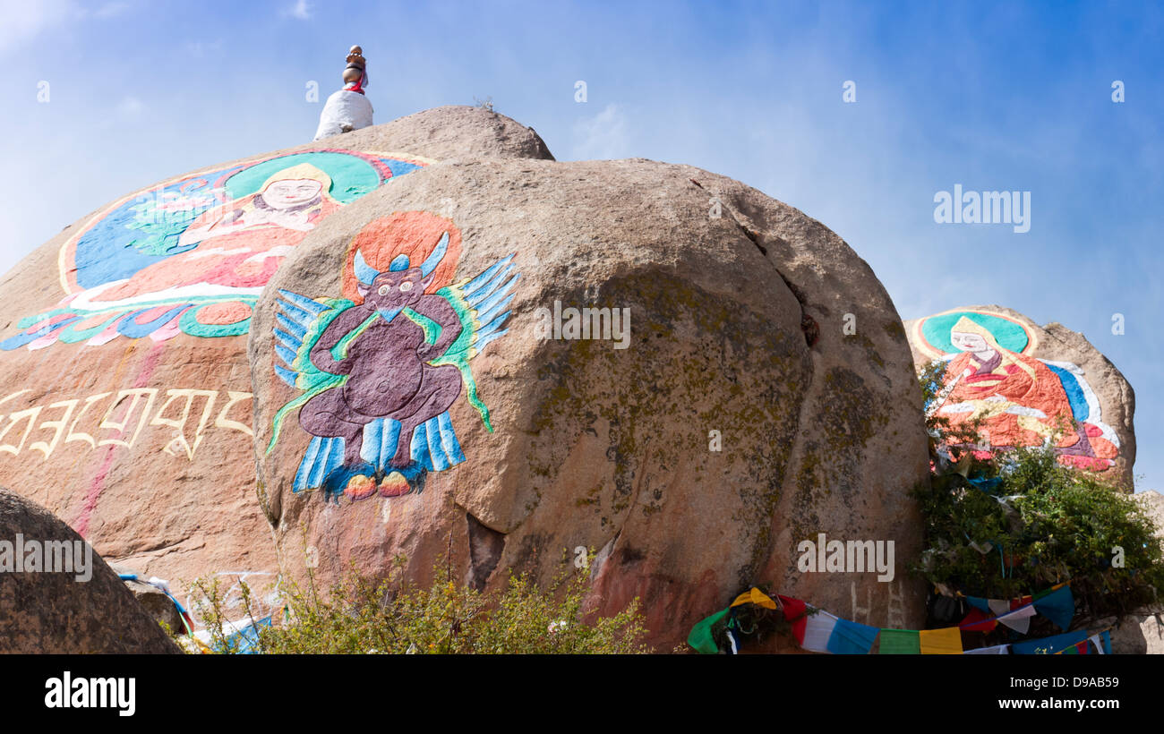 Buddha statue painted on huge stone at Drepung Monastery, Lhasa, Tibet, Drepung Monastery which was founded in 1416. Stock Photo