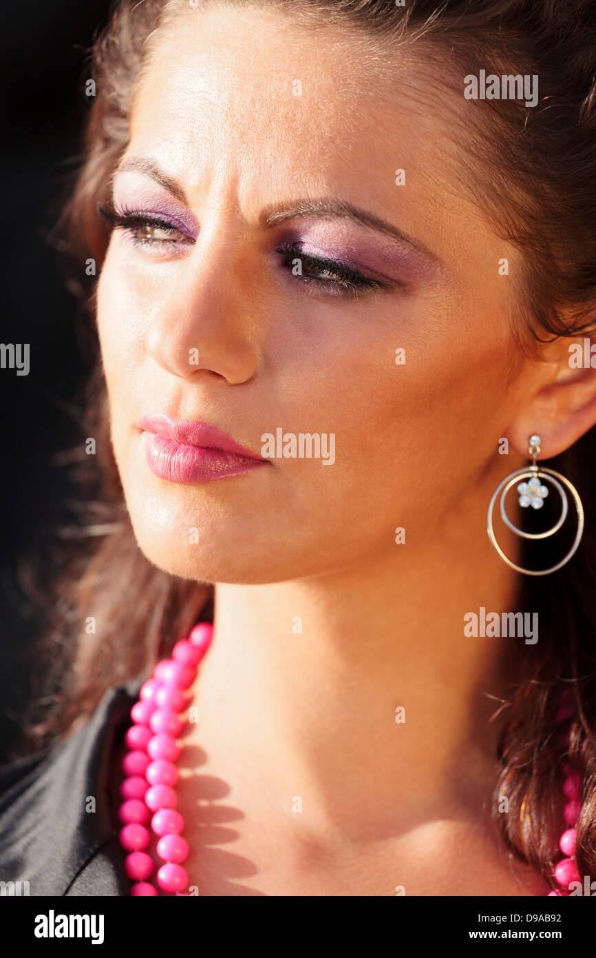 Close up headshot of pretty girl looking away. Stock Photo