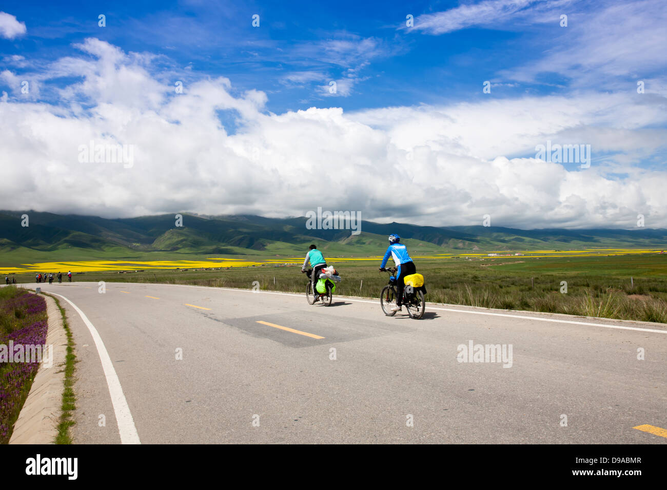 cyclists  riding bicycles outside Stock Photo