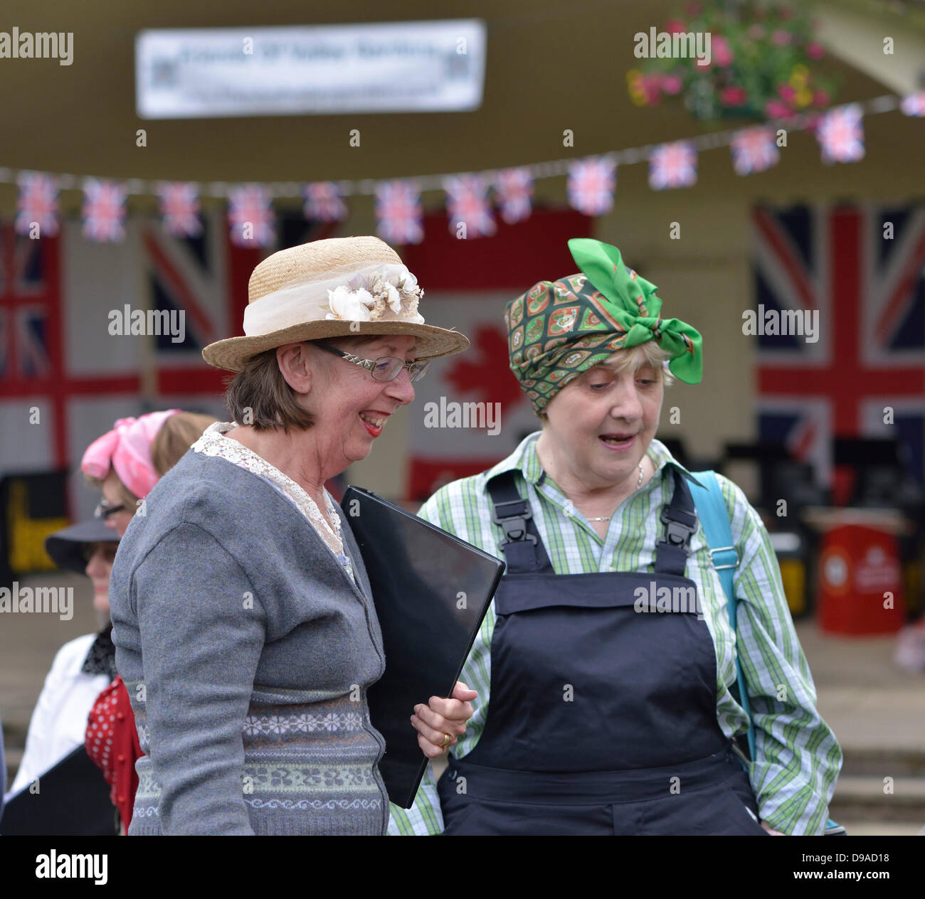 Harrogate, Yorkshire, UK. 16th June, 2013. Two women in 1940's dress at