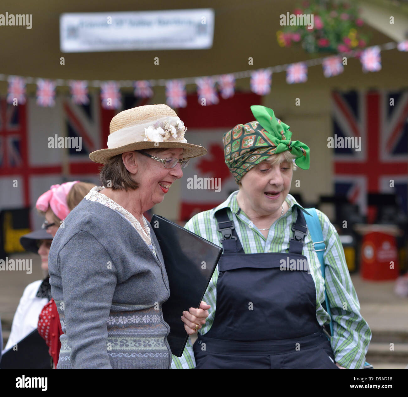 Harrogate, Yorkshire, UK. 16th June, 2013.  Two women in 1940's dress at an event in Valley Gardens, Harrogate,  to raise money for The Magnesia Well Pump Room Project to create an exhibition on mineral springs. Credit:  John Fryer/Alamy Live News Stock Photo
