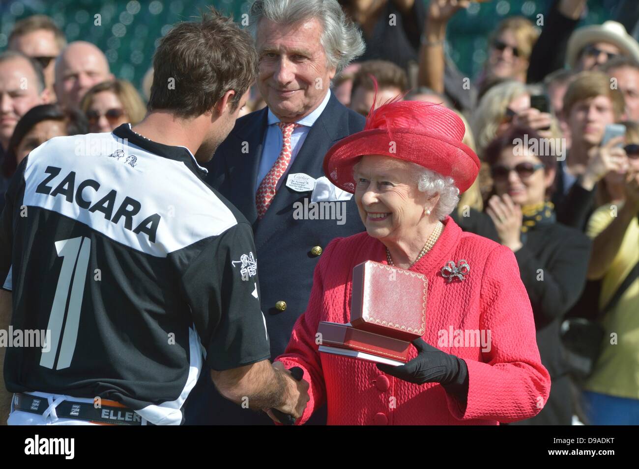Windsor, UK. 16th June, 2013. Her Majesty The Queen presents the The Cartier Queen's Cup to Facundo Pieres [1] of team Zacara.  Zacara beat El Remanso in the Final 15-9.  The Cartier Queen's Cup was played at Guards Polo Club Smiths Lawn Windsor Great Park on Sunday 16th June. Credit: Stephen Bartholomew/Stephen Bartholomew Photography/Alamy Live News Stock Photo