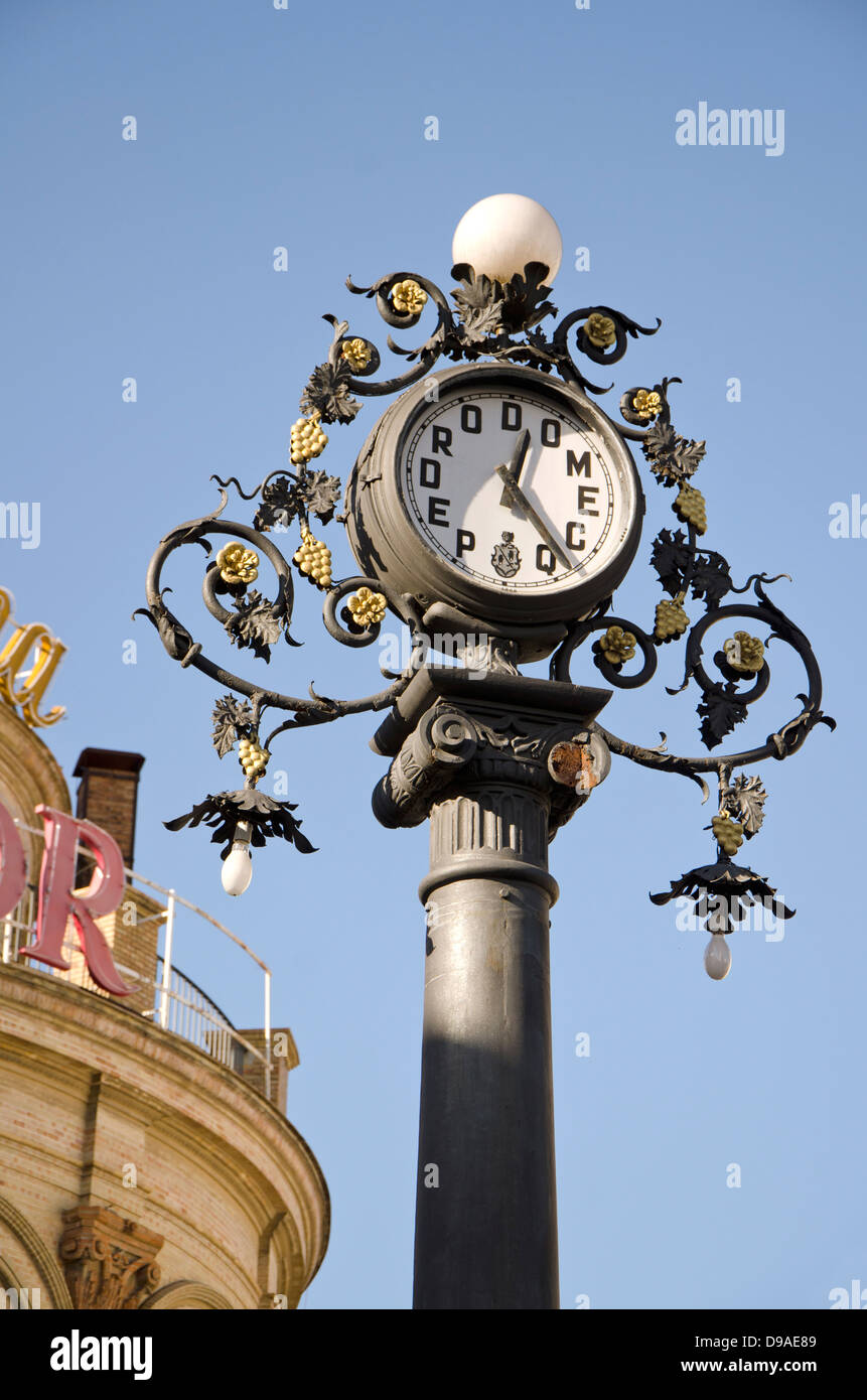Pedro Domecq clock in centre of Jerez de la Frontera with monument La ina in background, Andalusia, Spain. Stock Photo