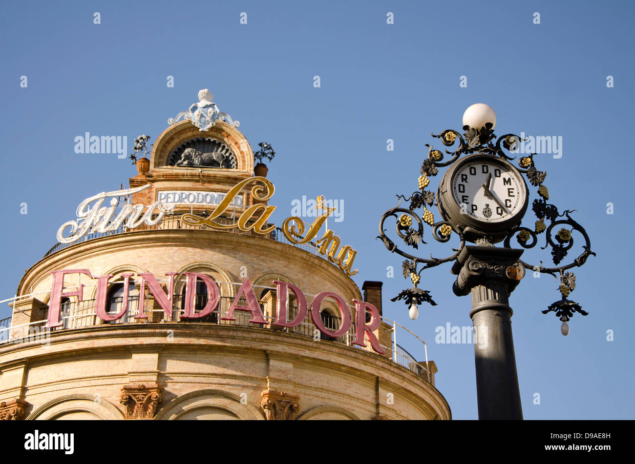 Pedro Domecq clock in centre of Jerez de la Frontera with monument La ina in background, Andalusia, Spain. Stock Photo