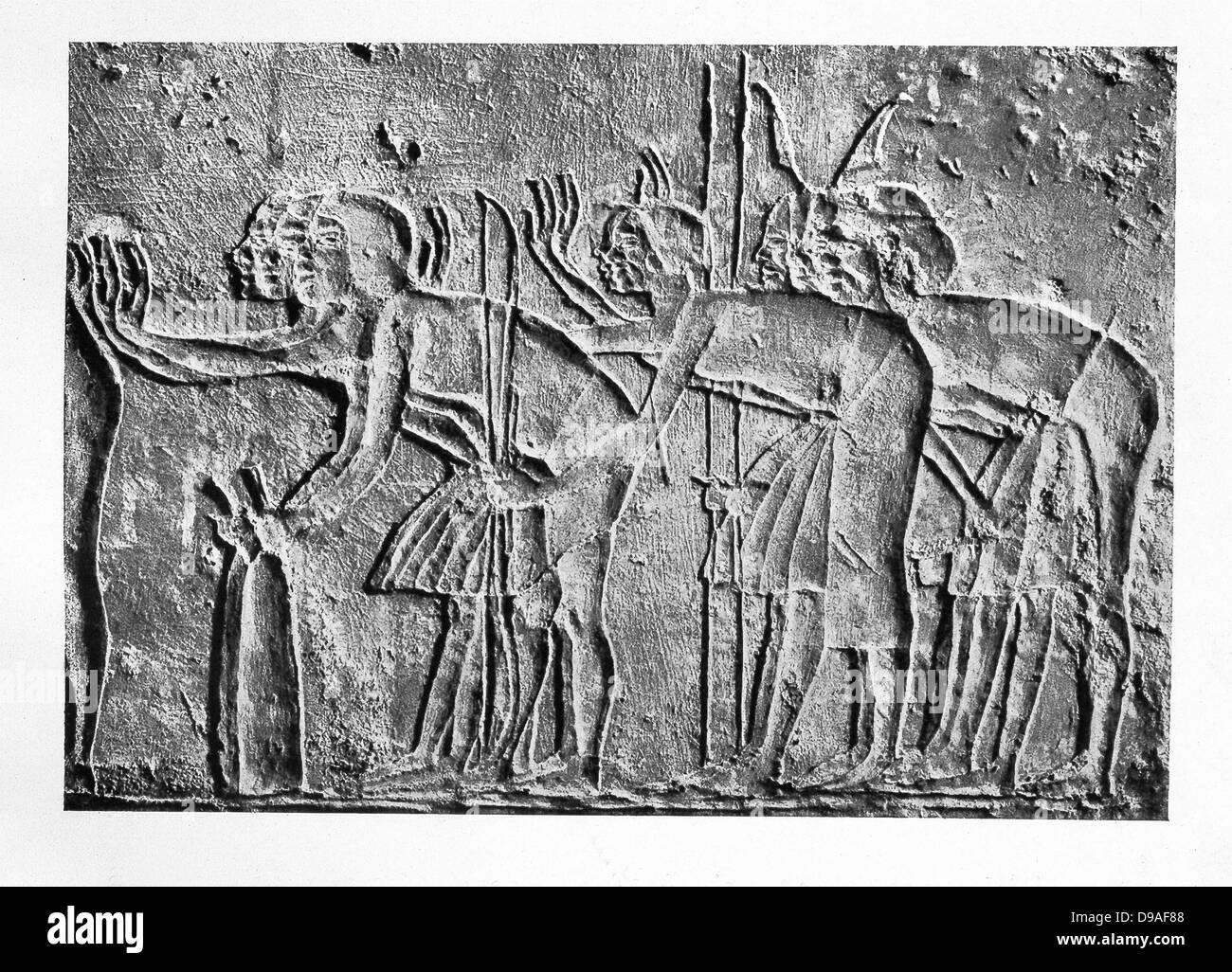 This limestone relief was uncovered in a grave at Akhetaten (Amarna) and shows attendants of Amenhotep IV (Akhenaten). Stock Photo