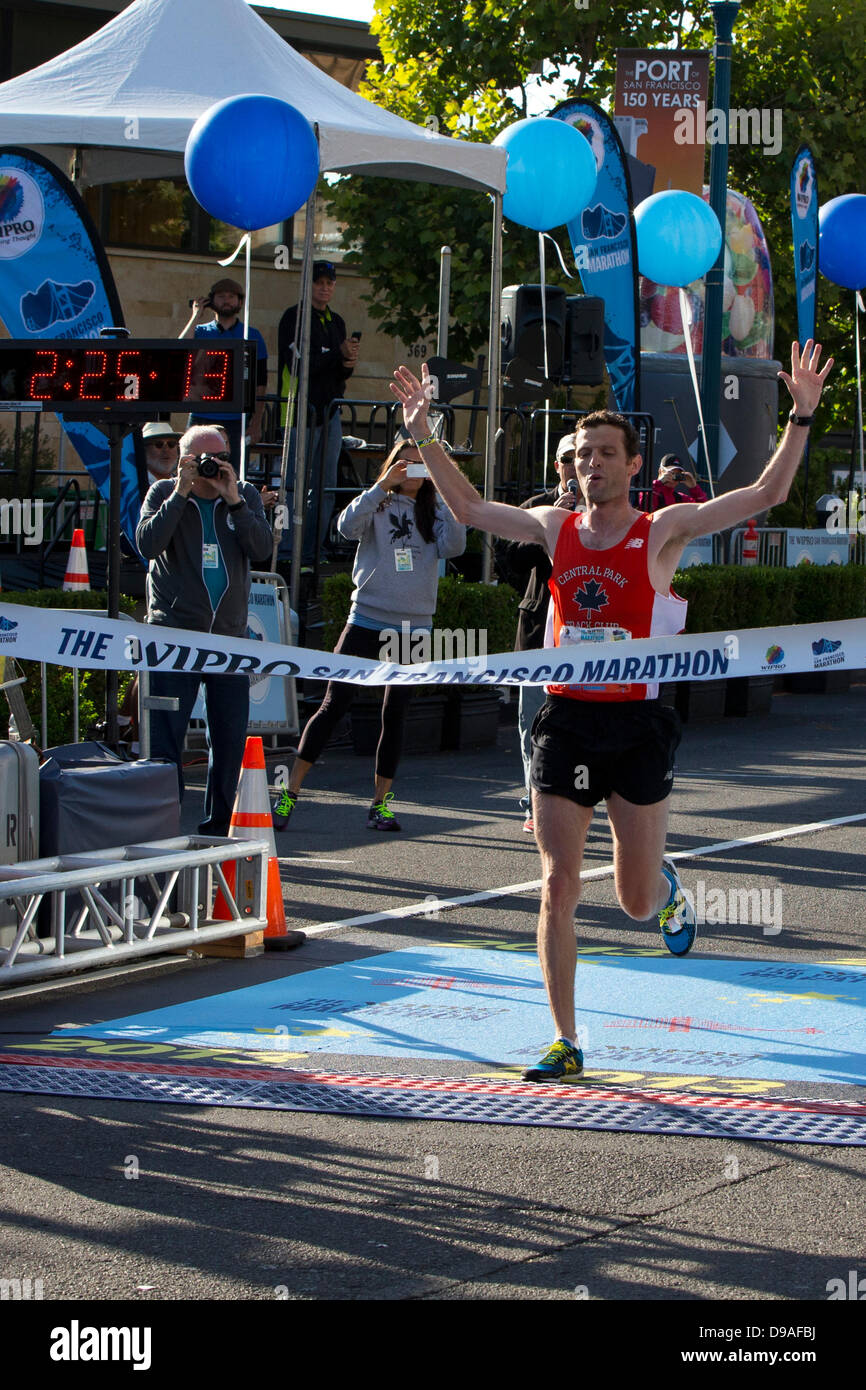 San Francisco, USA. 16th June, 2013. Francois Lhuissier crosses the finish line to win the 2013 San Francisco Marathon in San Francisco, California, United States of America on June 16, 2013. Credit:  Jason O. Watson/Alamy Live News Stock Photo