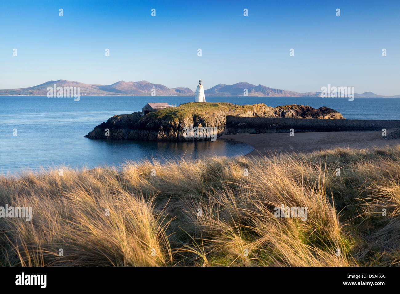Llanddwyn Island beach and lighthouse view across Caernarfon Bay to