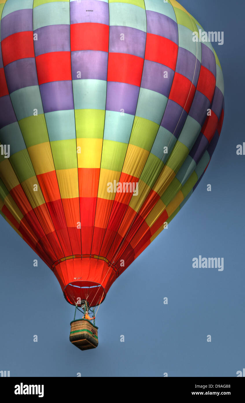 Hot air balloon flying in the blue sky Stock Photo - Alamy