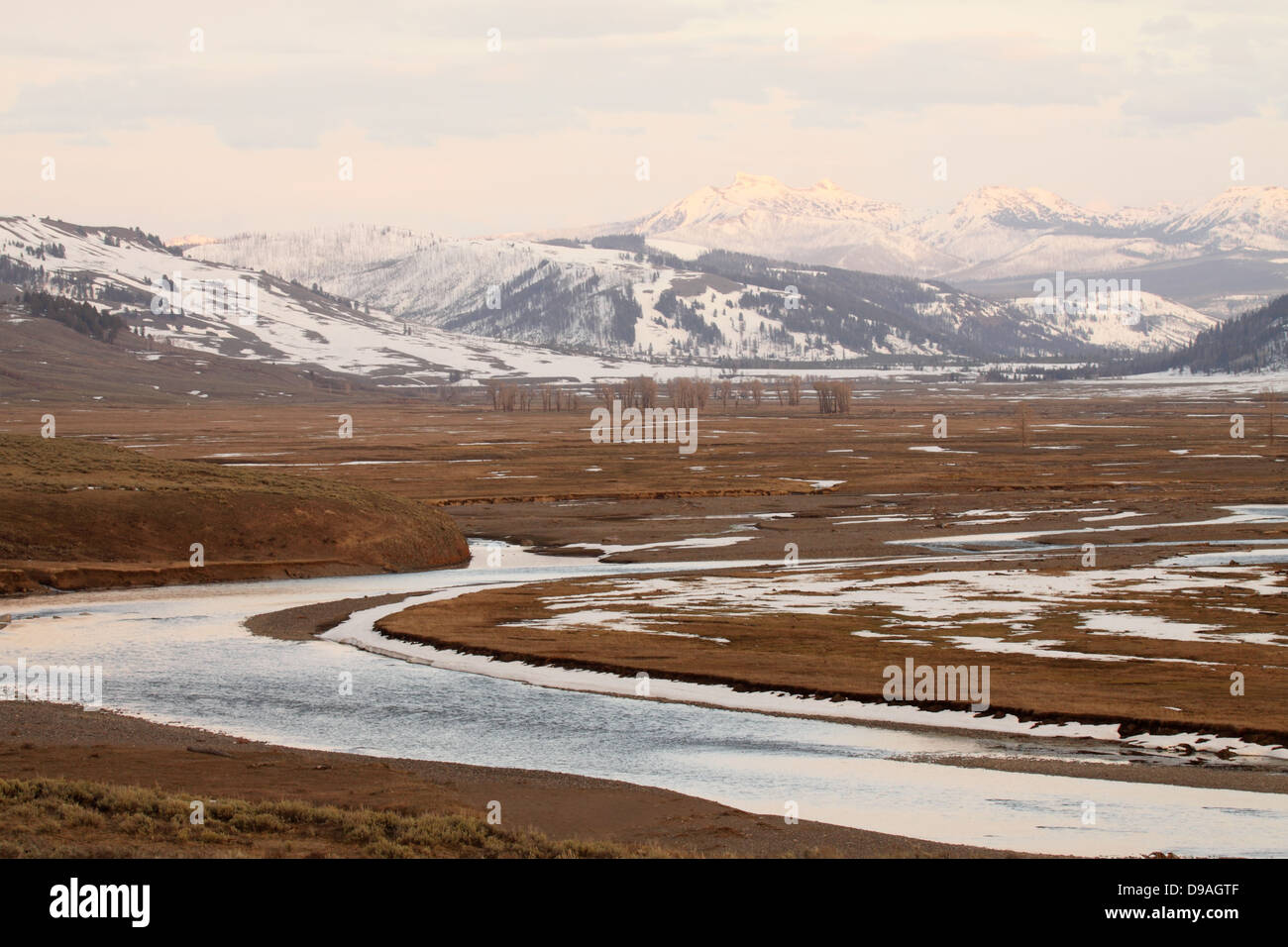 The Lamar River winding through the Lamar Valley beneath the Beartooth Mountains in northern Yellowstone National Park. Stock Photo