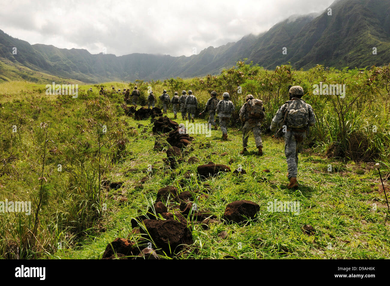 US Soldiers from the 25th Infantry Division move in combat formation