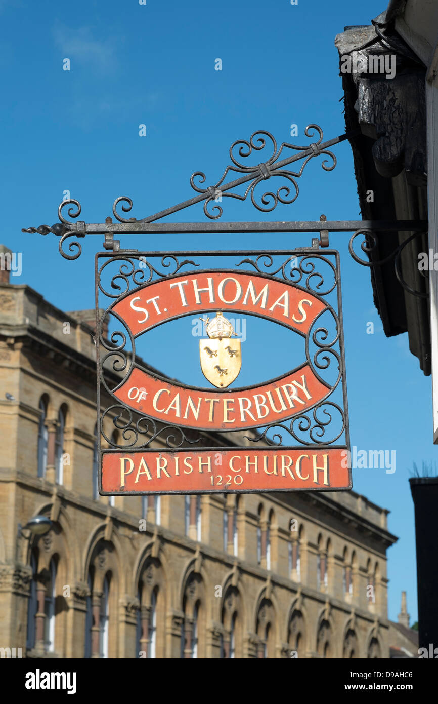 Old decorative iron sign hanging at the entrance to St Thomas Church in Salisbury Wiltshire UK Stock Photo