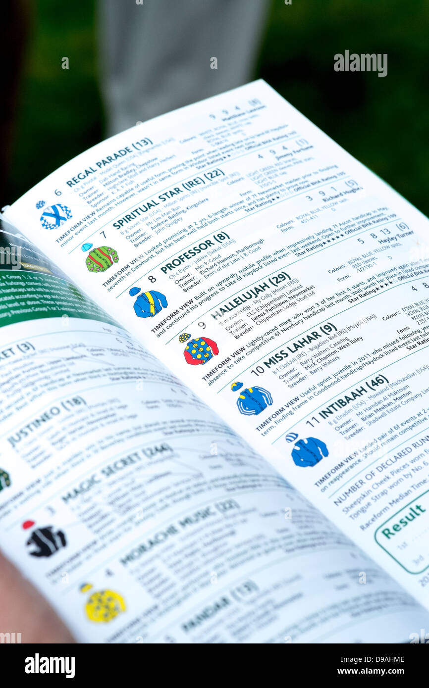 Horse racing programme showing list of runners and the riders colours Stock Photo
