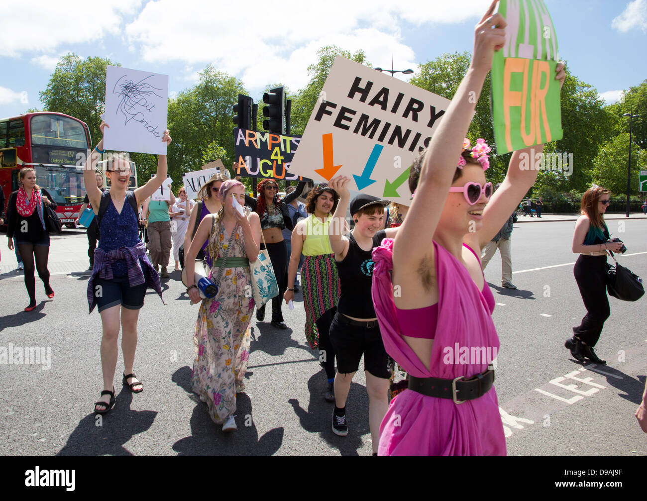 Women with placards at Marble Arch in London to raise awareness of the forthcoming Armpits 4 August sponsorship event. Stock Photo