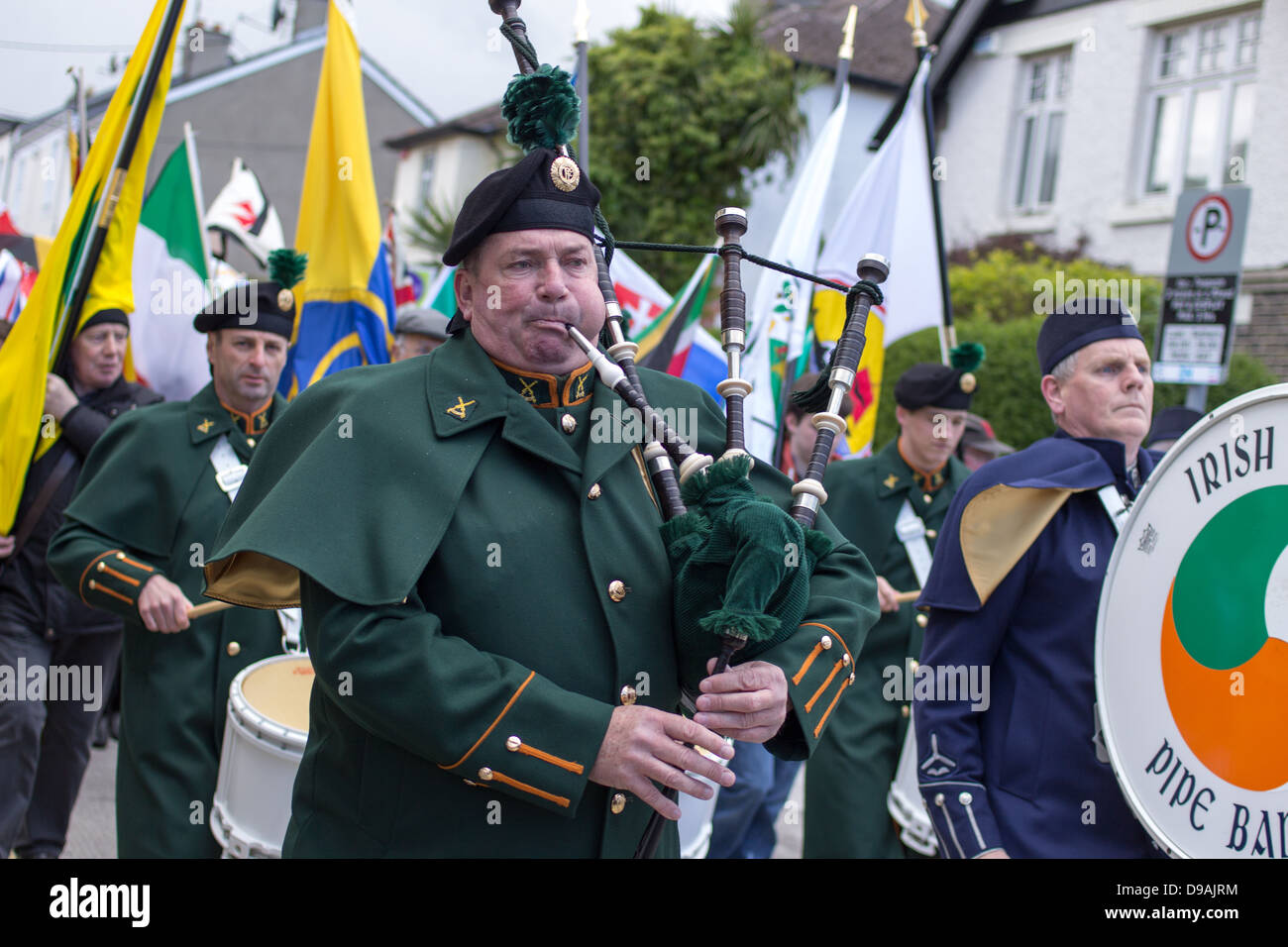A bagpiper plays on a bagpipe during the Parade of Flags and Emblems in ...