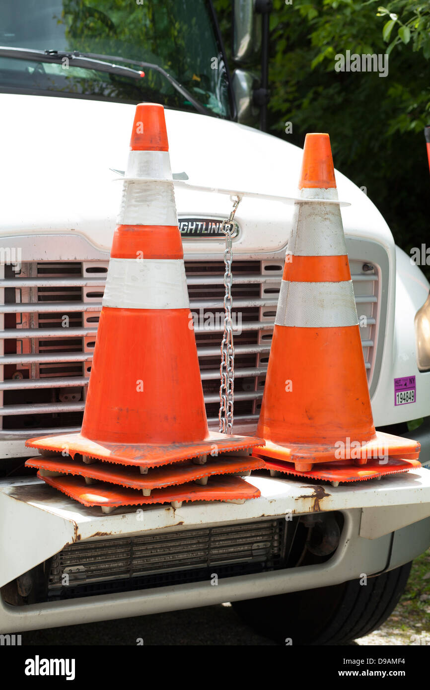 Plastic safety cones are carried on the front of the power company's
