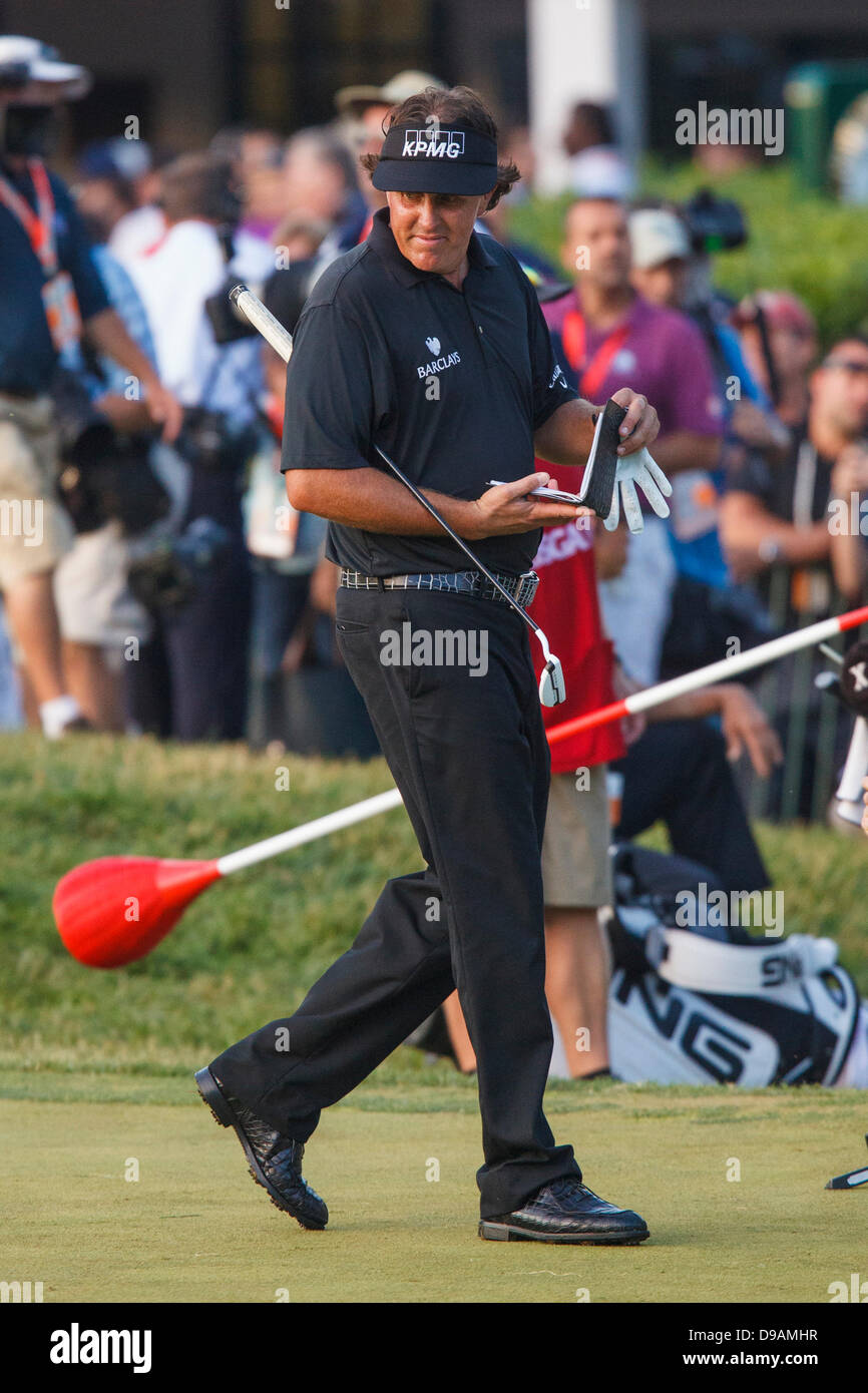 Merion, Pa, USA. 16th June, 2013. Phil Mickelson, of the United States, looks back at the 18th hole during the 2013 U.S. Open 113th National Championship at the Merion Golf Club in Ardmore, Pennsylvania. Justin Rose, of England, wins the 2013 U.S. Open 113th National Championship. Credit: csm/Alamy Live News Stock Photo