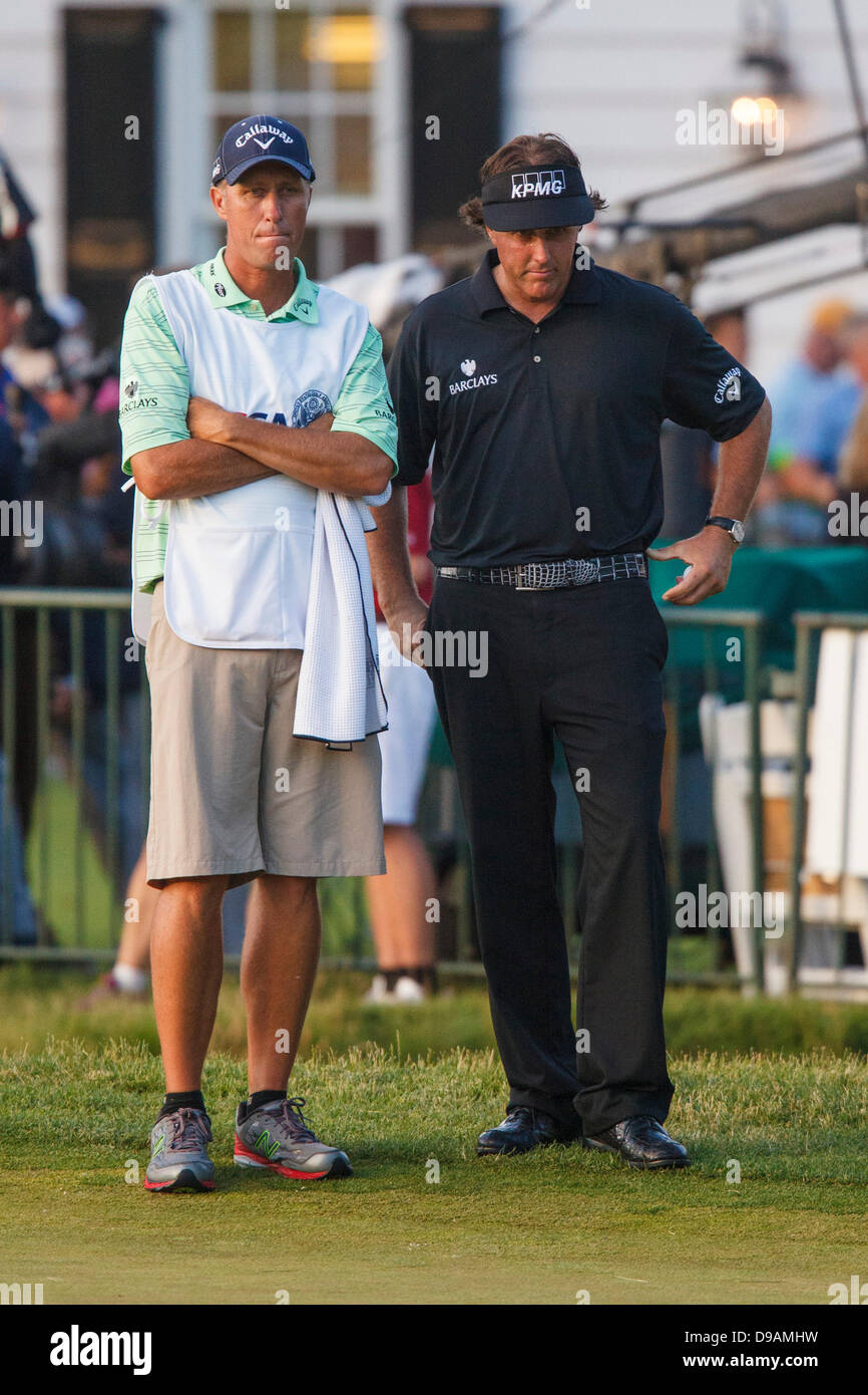 Merion, Pa, USA. 16th June, 2013. Phil Mickelson, of the United States, looks on with his caddy after scoring a bogey on the 18th hole during the 2013 U.S. Open 113th National Championship at the Merion Golf Club in Ardmore, Pennsylvania. Justin Rose, of England, wins the 2013 U.S. Open 113th National Championship. Credit: csm/Alamy Live News Stock Photo