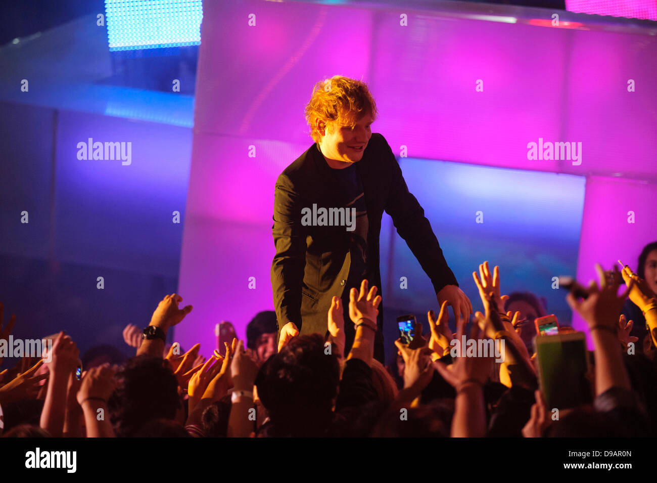 Toronto, Canada. 16th June, 2013.  Ed Sheeran performs at the 2013 MMVA in Toronto Canada. The MuchMusic Video Awards took over the trendy Queen West village in Toronto for an award show featuring PSY and other super stars including Avril Lavigne, Demi Lovato, Serena Ryder, Ed Sheeran, Marianas Trench, Classified, and Armin Van Buuren with Trevor Guthrie. Credit:  Victor Biro/Alamy Live News Stock Photo