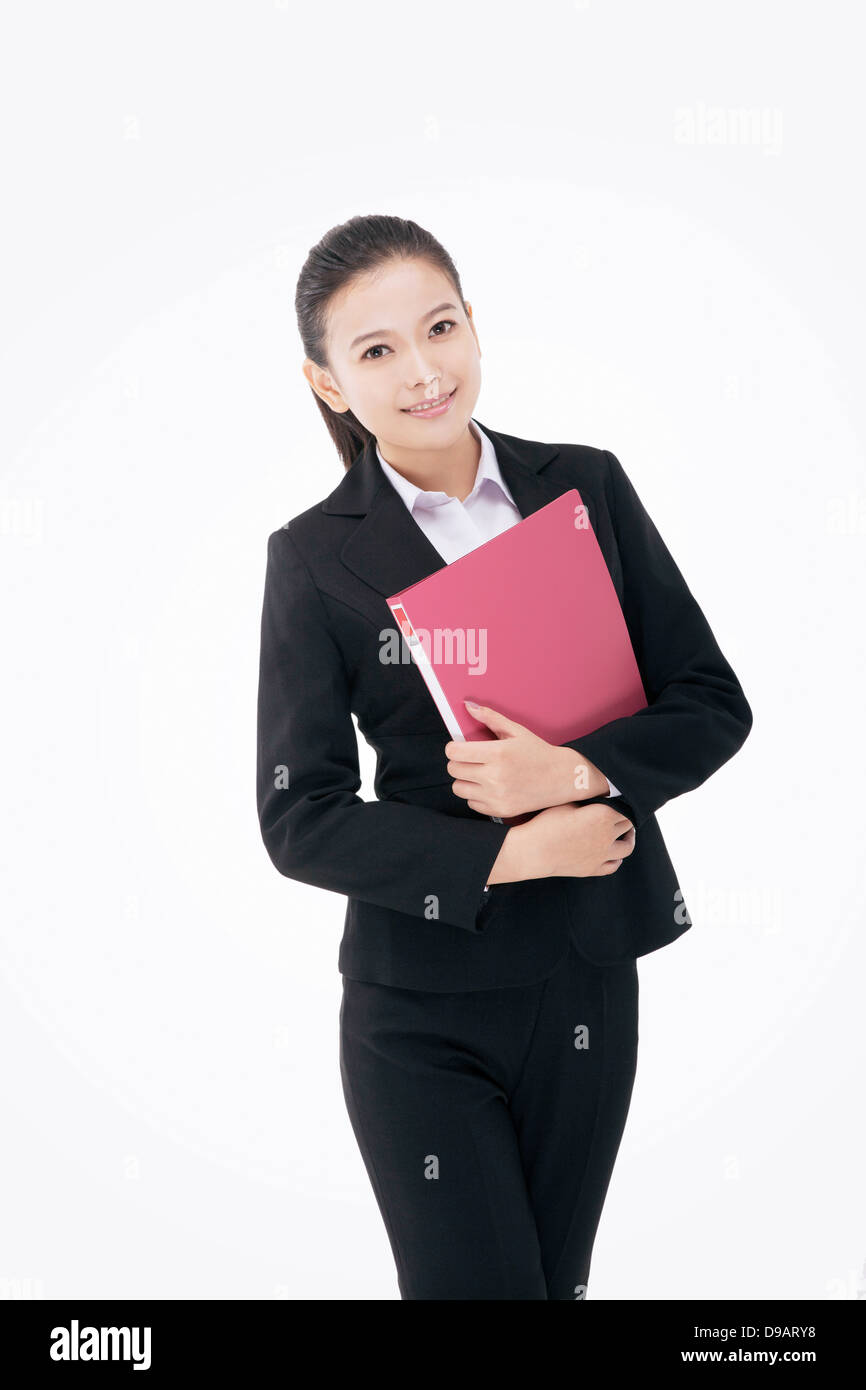 Fashion business woman holding a folder Stock Photo - Alamy