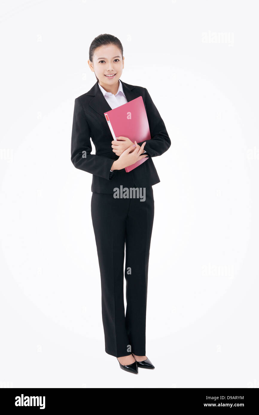 Fashion business woman holding a folder Stock Photo - Alamy