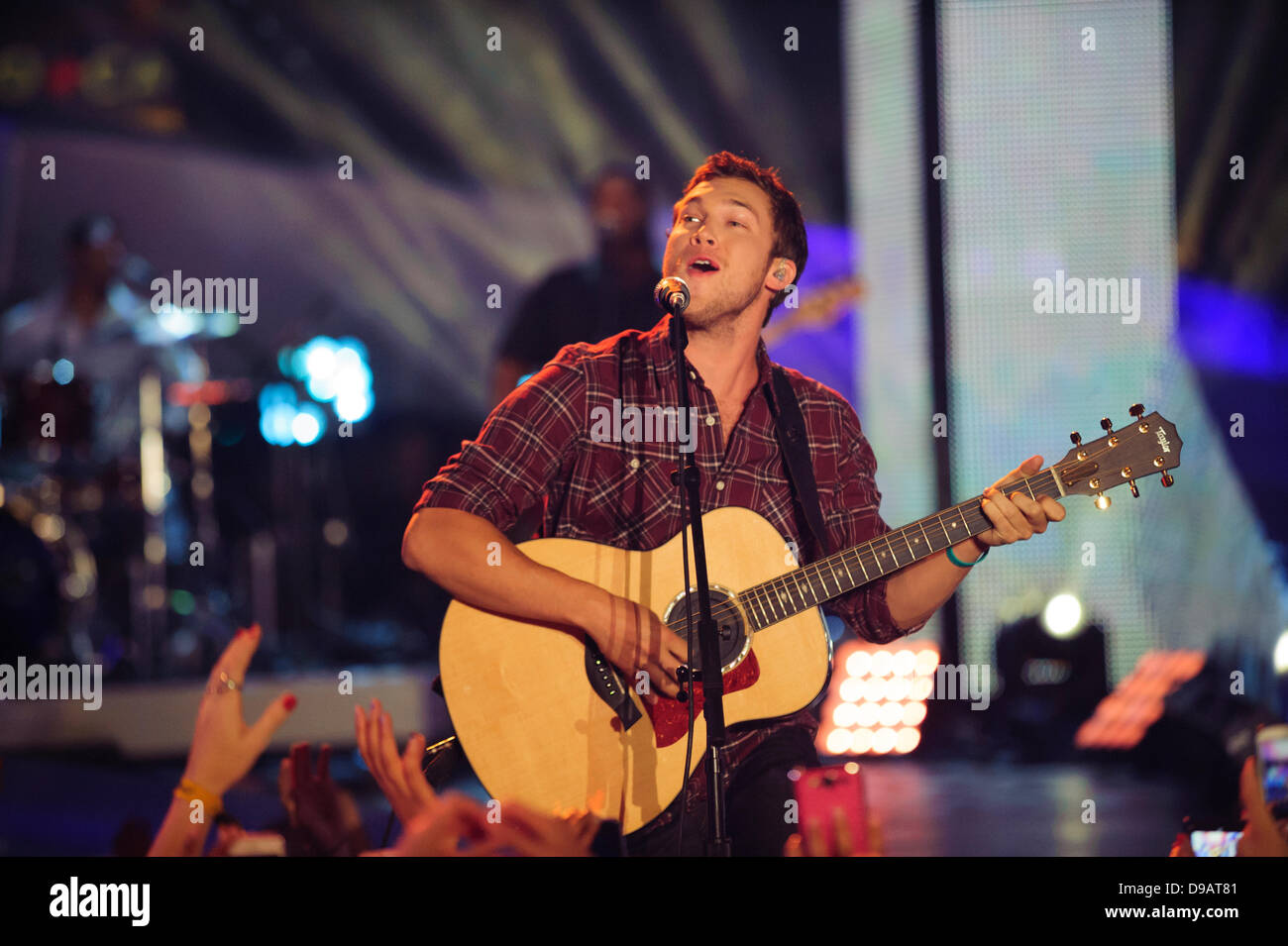 Toronto, Canada. 16th June, 2013. Phillip Phillips performs at the 2013 MMVA in Toronto Canada. The MuchMusic Video Awards took over the trendy Queen West village in Toronto for an award show featuring PSY and other super stars including Avril Lavigne, Demi Lovato, Serena Ryder, Ed Sheeran, Marianas Trench, Classified, and Armin Van Buuren with Trevor Guthrie. Credit:  Victor Biro/Alamy Live News Stock Photo