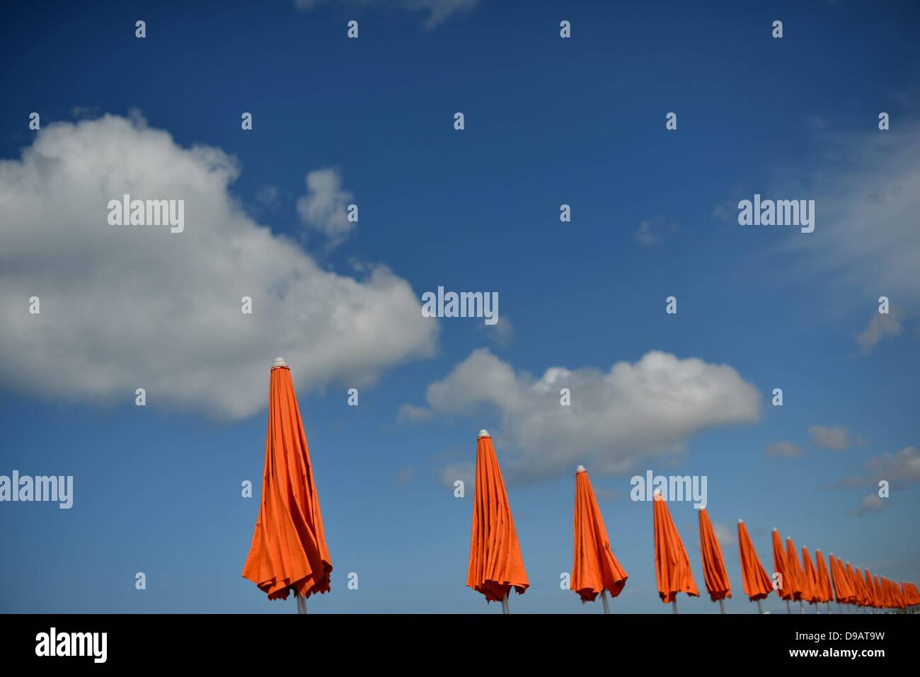 Umbrellas at the beach in Italy. Photo: Frank May Stock Photo - Alamy