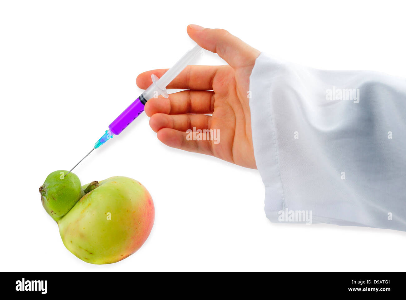 Genetic Modification - purple Liquid injecting into Apple Stock Photo