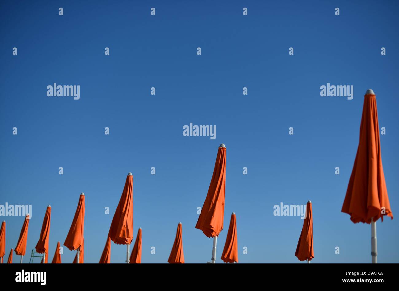 Umbrellas at the beach in Italy. Photo: Frank May Stock Photo - Alamy